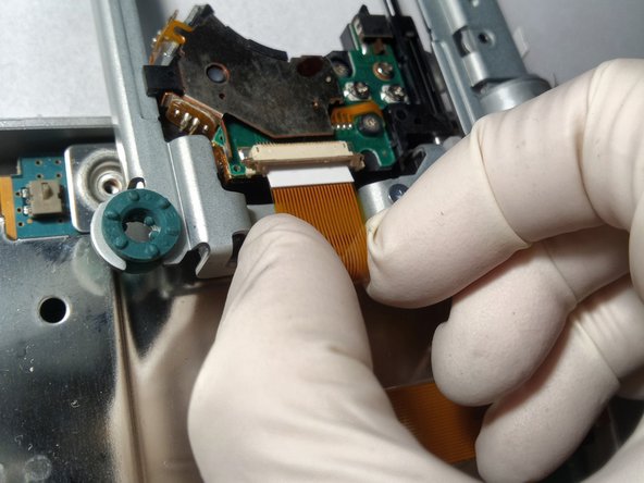 Sony Playstation 2 SCPH-77004 Laser Replacement, Unscrewing the Drive: crwdns2935265:012crwdnd2935265:03crwdnd2935265:03crwdne2935265:0