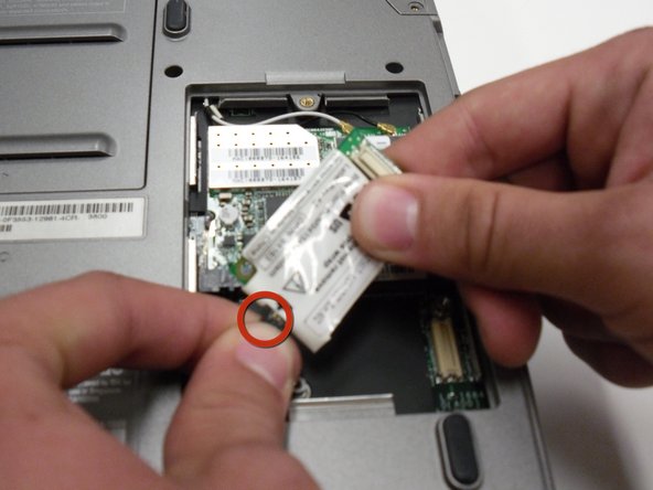 Removing the Dell Inspiron 1150 Modem Card: crwdns2935265:04crwdnd2935265:02crwdnd2935265:02crwdne2935265:0