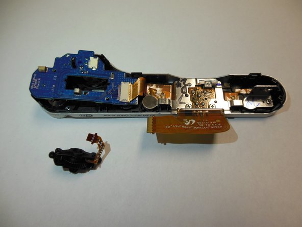Samsung NX300 Jog and Mode Dial Replacement, Remove the Connecting Ribon: crwdns2935265:09crwdnd2935265:03crwdnd2935265:03crwdne2935265:0