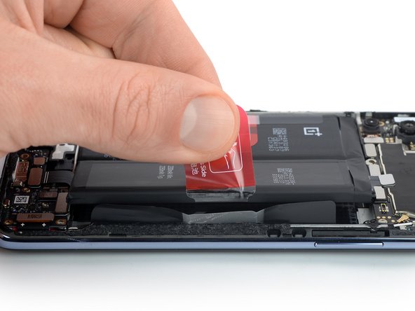 OnePlus Nord 2 5G Battery Replacement, Lift the right half of the battery: crwdns2935265:020crwdnd2935265:02crwdnd2935265:02crwdne2935265:0