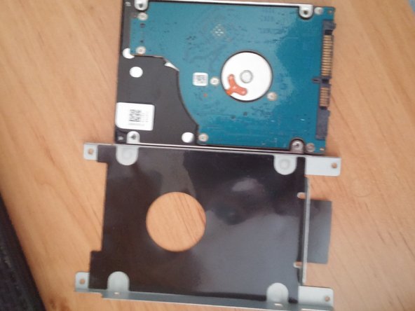 Asus K52JC Laptop Hard Drive Replacement, Remove the hard drive from its metal support bracket: crwdns2935265:04crwdnd2935265:03crwdnd2935265:03crwdne2935265:0