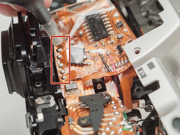 Pentax ZX-5n Mirror Drive Lever Replacement, Desolder flex cable: step 12, image 1 of 1