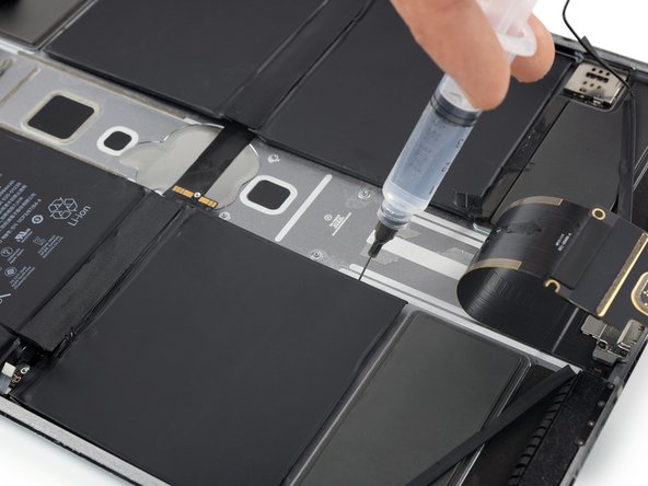 iPad Pro 12.9" 2nd Gen Battery Replacement, Loosen the bottom left battery cell: crwdns2935265:070crwdnd2935265:02crwdnd2935265:03crwdne2935265:0