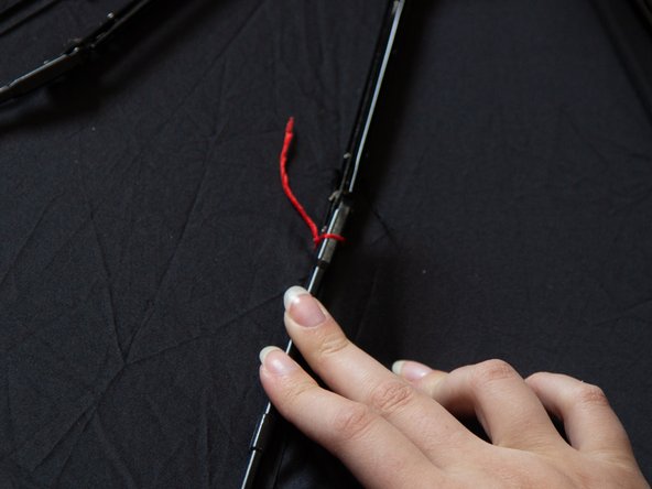 How to Reattach a Metal Rib to Fabric Panel on an Umbrella: step 5, image 3 of 3