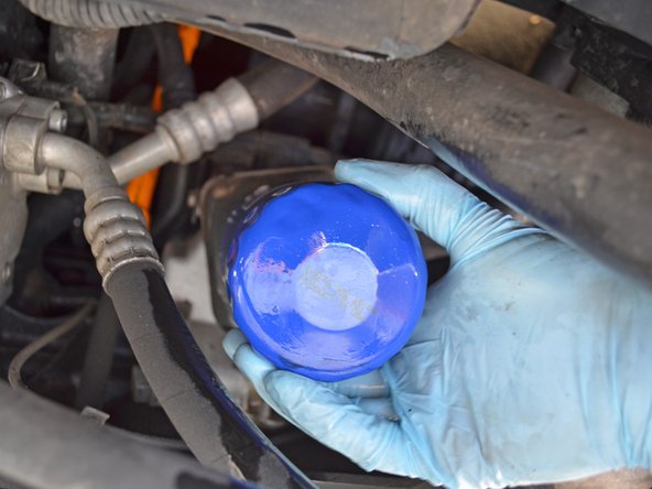 Twist the filter clockwise to screw it into place. Tighten it only until the filter is snug; do not over-tighten.