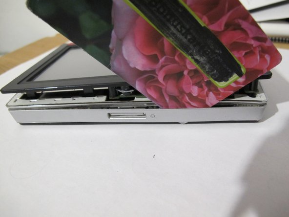 Navi Falk Neo550 Battery Replacement, Remove the edge cover: step 3, image 2 of 3