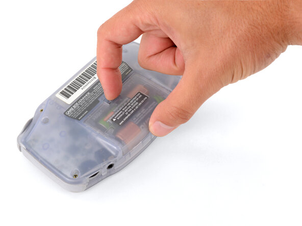 Game Boy Advance Screen Lens Replacement, Remove the battery cover: crwdns2935265:02crwdnd2935265:01crwdnd2935265:03crwdne2935265:0