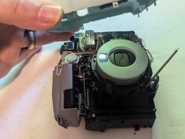 Fujifilm Instax Mini 9 Camera Shell Replacement, Remove the Front Cover: crwdns2935265:014crwdnd2935265:02crwdnd2935265:03crwdne2935265:0