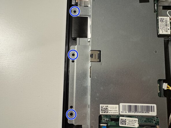 Dell Inspiron 20 3043 CMOS Battery Replacement, Detach and flip the system board: step 11, image 1 of 2