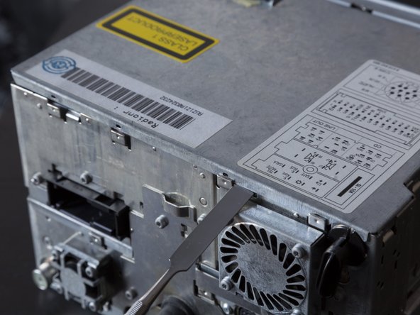 Disassembling Audi Navigation Plus unit, Removing top cover: step 4, image 2 of 3