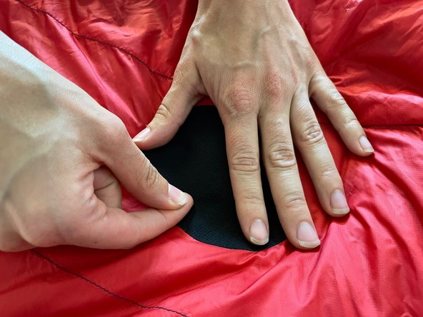 How to Patch a Fabric Tear in a Sleeping Bag, Stick the patch over the hole: crwdns2935265:03crwdnd2935265:03crwdnd2935265:03crwdne2935265:0