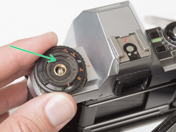 Pentax Super Program Top Cover Removal, Remove exposure compensation dial: crwdns2935265:03crwdnd2935265:03crwdnd2935265:03crwdne2935265:0