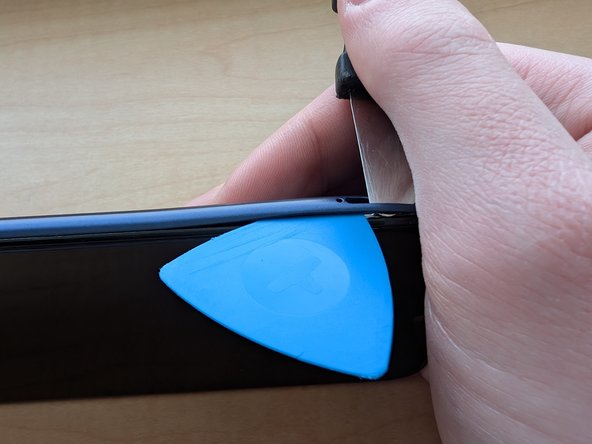 Motorola Moto G Play (2023) Teardown, Remove part of the back plate: crwdns2935265:02crwdnd2935265:02crwdnd2935265:03crwdne2935265:0