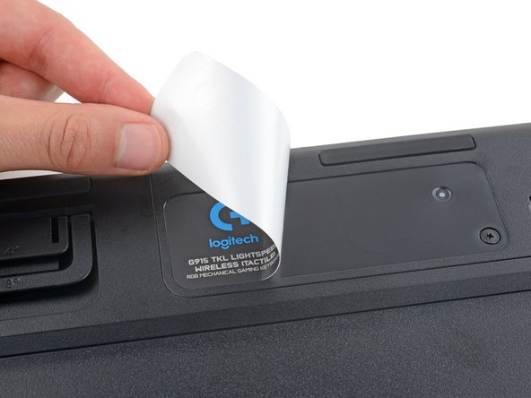 Logitech G915 TKL Battery Replacement, Apply the battery cover sticker: crwdns2935265:015crwdnd2935265:01crwdnd2935265:01crwdne2935265:0