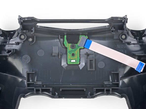 DualShock 4 CUH-ZCT2 Charging Assembly Replacement, Remove the charging assembly: crwdns2935265:010crwdnd2935265:02crwdnd2935265:02crwdne2935265:0