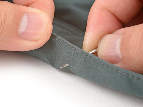 How to Install a Plastic Snap With a Handheld Tool, Pierce the fabric: crwdns2935265:02crwdnd2935265:02crwdnd2935265:02crwdne2935265:0