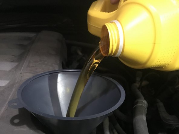 Reinstall oil fill cap once filling oil is complete