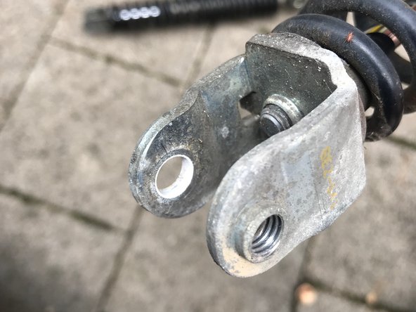 Replace Honda Zoomer shock absorbers, Remove shock absorber: step 7, image 3 of 3