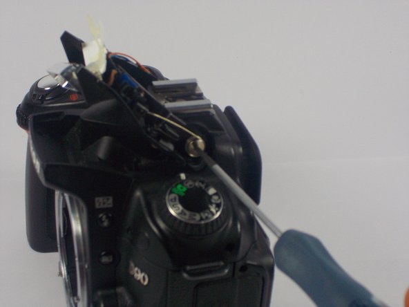 Nikon D90 Flash Hinge Spring Replacement, Loosening the Spring Screw: crwdns2935265:04crwdnd2935265:02crwdnd2935265:02crwdne2935265:0