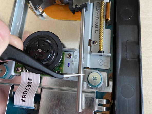 PlayStation 2 Slimline PVR-802W Laser Replacement, Remove silver rail: crwdns2935265:06crwdnd2935265:03crwdnd2935265:03crwdne2935265:0