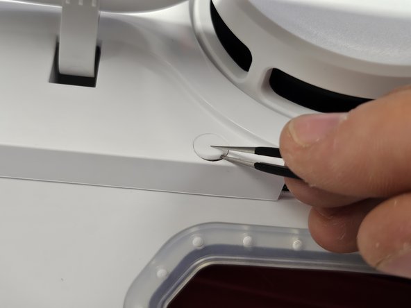 Roborock Q Revo: Laser Distance Sensor Replacement, Remove the rubber cap covering a screw.: crwdns2935265:02crwdnd2935265:02crwdnd2935265:03crwdne2935265:0