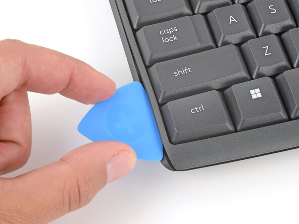 How to Open Your Logitech K295 Keyboard, Insert an opening pick: crwdns2935265:06crwdnd2935265:03crwdnd2935265:03crwdne2935265:0