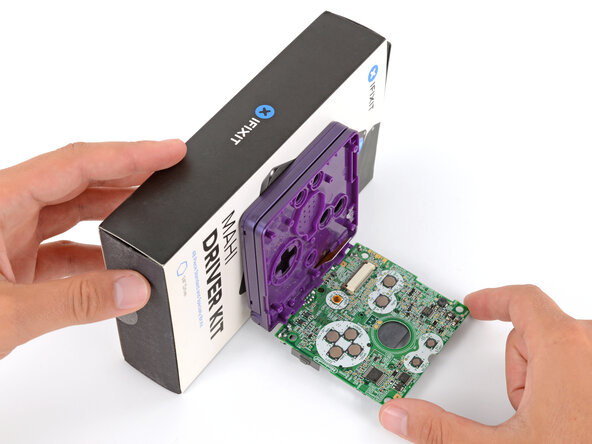 How to Reshell Your Game Boy Advance SP, Prop up the main body: crwdns2935265:052crwdnd2935265:03crwdnd2935265:03crwdne2935265:0