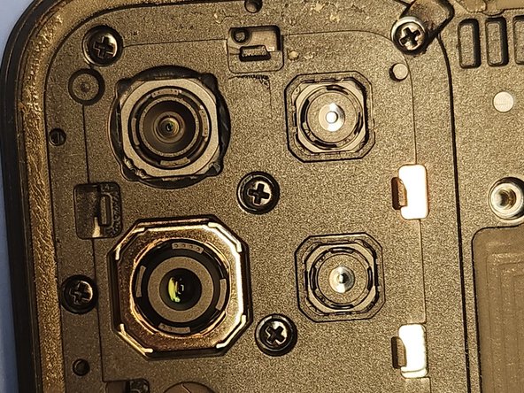 Revvl 6 Pro 5G Screen Replacement, Remove the Camera Screws: crwdns2935265:011crwdnd2935265:02crwdnd2935265:02crwdne2935265:0