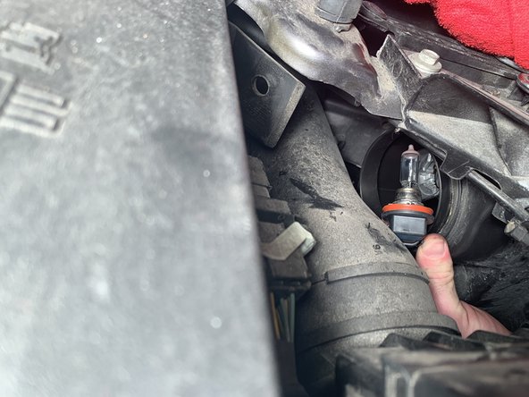 2012 Ford Fusion Headlight Replacement: step 6, image 2 of 2