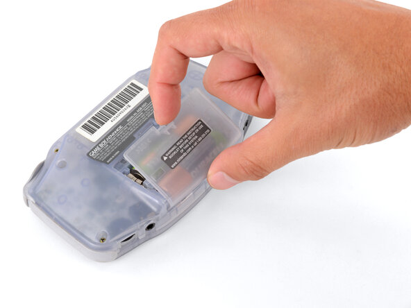 How to Reshell Your Game Boy Advance, Remove the battery cover: crwdns2935265:02crwdnd2935265:02crwdnd2935265:03crwdne2935265:0
