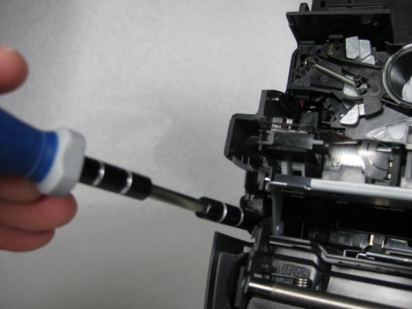 Once the tabs are removed slide the metal frame forward.