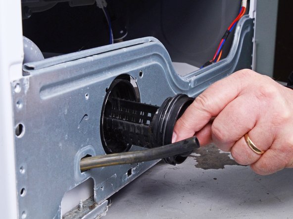 LG Front Load Washing Machine Drain Pump Motor Replacement, Remove the pump filter: crwdns2935265:027crwdnd2935265:03crwdnd2935265:03crwdne2935265:0