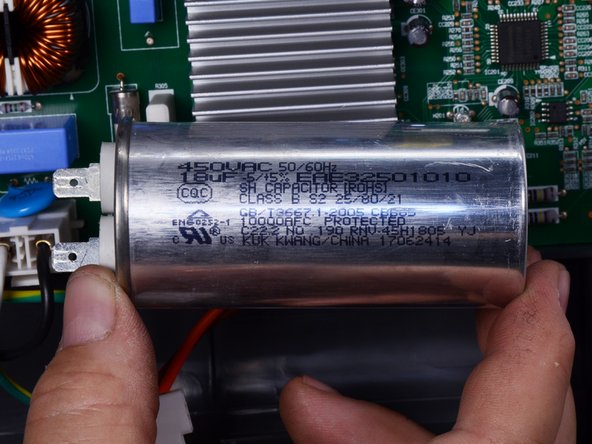 LG Refrigerator Compressor Run Capacitor Replacement, Disconnect the capacitor: crwdns2935265:05crwdnd2935265:03crwdnd2935265:03crwdne2935265:0