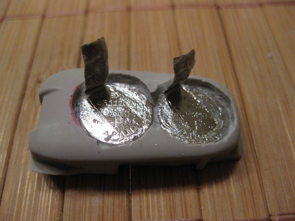 Dexcom G4 Batteries Replacement, Move up both contact plates with a screwdriver: step 3, image 2 of 2