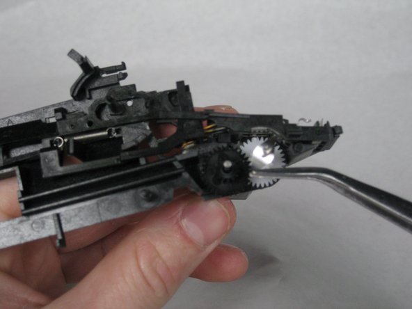 The gear on the left goes first, followed by the the right.