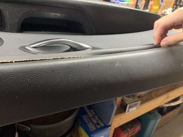 Push the liner into place in between the door panel sections.