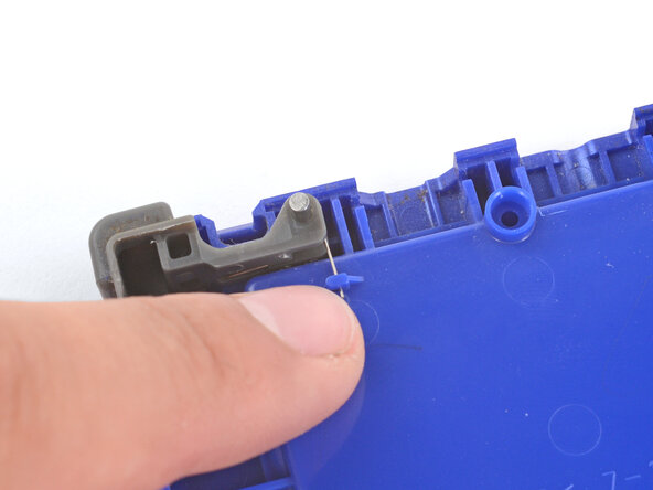 How to Install Shoulder Buttons in Your Game Boy Advance SP, Push the spring arm into place: crwdns2935265:04crwdnd2935265:02crwdnd2935265:02crwdne2935265:0