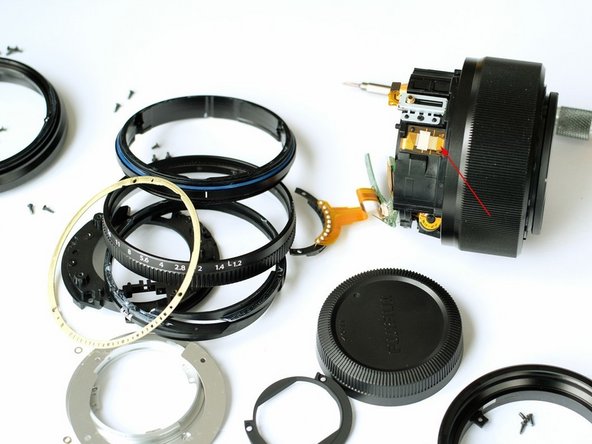 Fujinon XF 56mm F1.2 R lens Disassembly, Pulling out lens core module: step 11, image 1 of 2