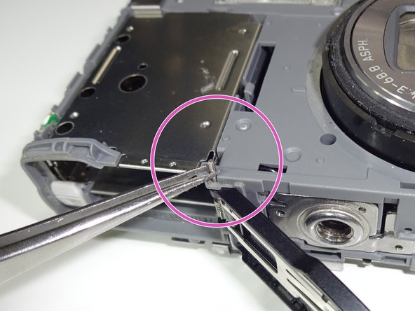 Panasonic DMC-ZS8 Digital Camera Door Replacement, Removing the door: step 4, image 2 of 3