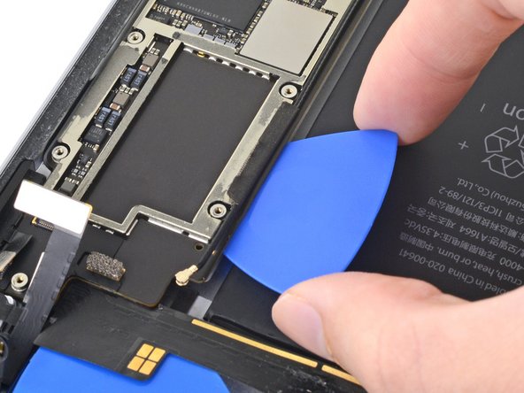 iPad Pro 9.7" Battery Replacement, Cut through the adhesive under the logic board: step 92, image 2 of 2