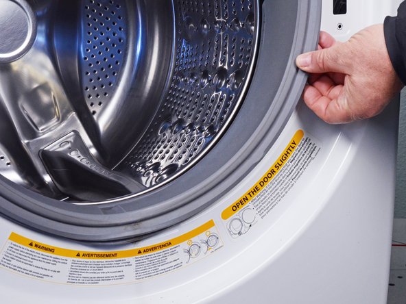 LG Front Load Washing Machine Temperature Sensor Replacement, Disconnect the boot: crwdns2935265:015crwdnd2935265:03crwdnd2935265:03crwdne2935265:0