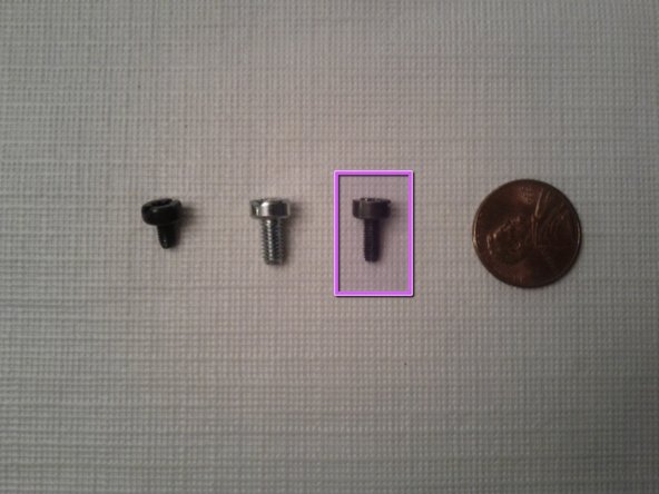 Removing back panel and components to to get to CPU: passo 3, immagine 2 di 2