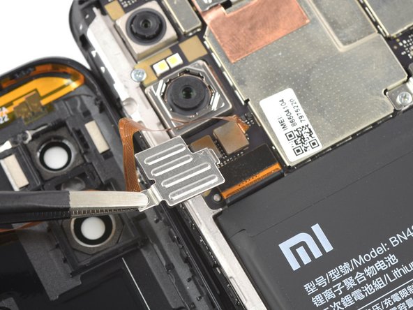 Xiaomi Redmi Note 6 Pro Battery Replacement, Remove the metal cover: crwdns2935265:09crwdnd2935265:03crwdnd2935265:03crwdne2935265:0