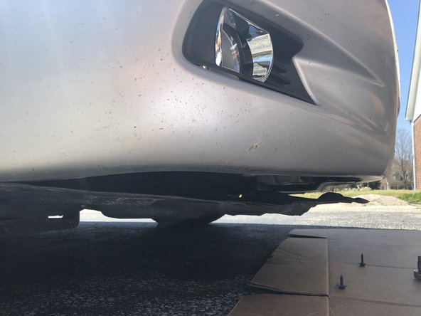 2009 Toyota Camry SE Fog light bulb, lamp, and housing Replacement, Remove the plastic underside shield: step 3, image 3 of 3