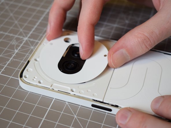 Nothing Phone (2a) Battery Replacement, Replace the sticker surrounding the camera units: crwdns2935265:034crwdnd2935265:02crwdnd2935265:02crwdne2935265:0