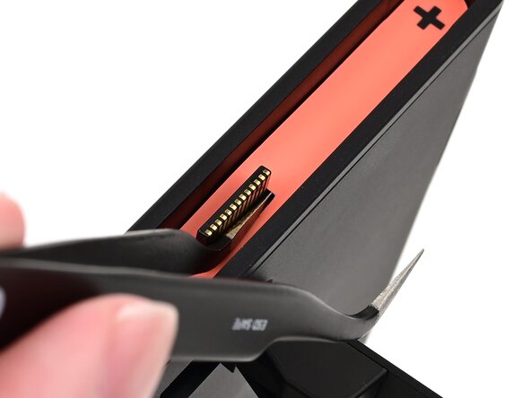 Nintendo Switch 2 Microphone Replacement, Pry up the right side sticker: crwdns2935265:05crwdnd2935265:02crwdnd2935265:03crwdne2935265:0