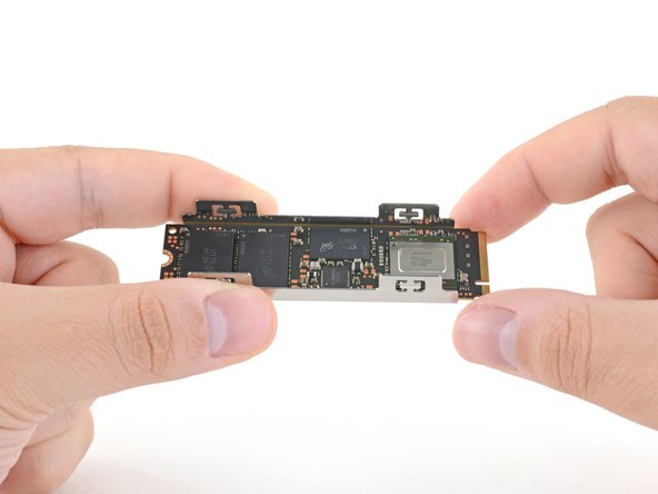 How to Install a Heatsink on an M.2 SSD, Lay the SSD in the tray: crwdns2935265:06crwdnd2935265:03crwdnd2935265:03crwdne2935265:0
