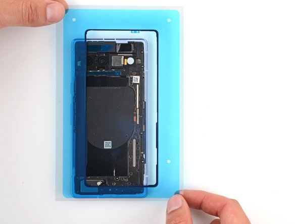 How to Apply Rear Cover Adhesive in Your Google Pixel 7a, Orient the rear cover perimeter adhesive: crwdns2935265:06crwdnd2935265:03crwdnd2935265:03crwdne2935265:0
