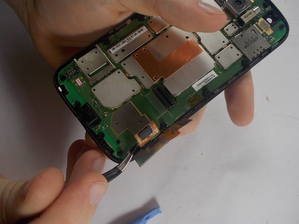 Motorola Moto G 1st Generation Display Assembly Replacement, Releasing the Ribbon cable.: crwdns2935265:08crwdnd2935265:02crwdnd2935265:02crwdne2935265:0
