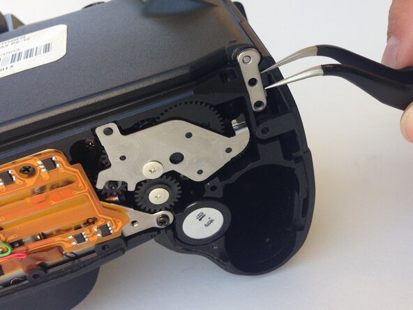 Pentax PZ-10 Back Cover Locking Switch Spring Replacement: crwdns2935265:05crwdnd2935265:01crwdnd2935265:01crwdne2935265:0